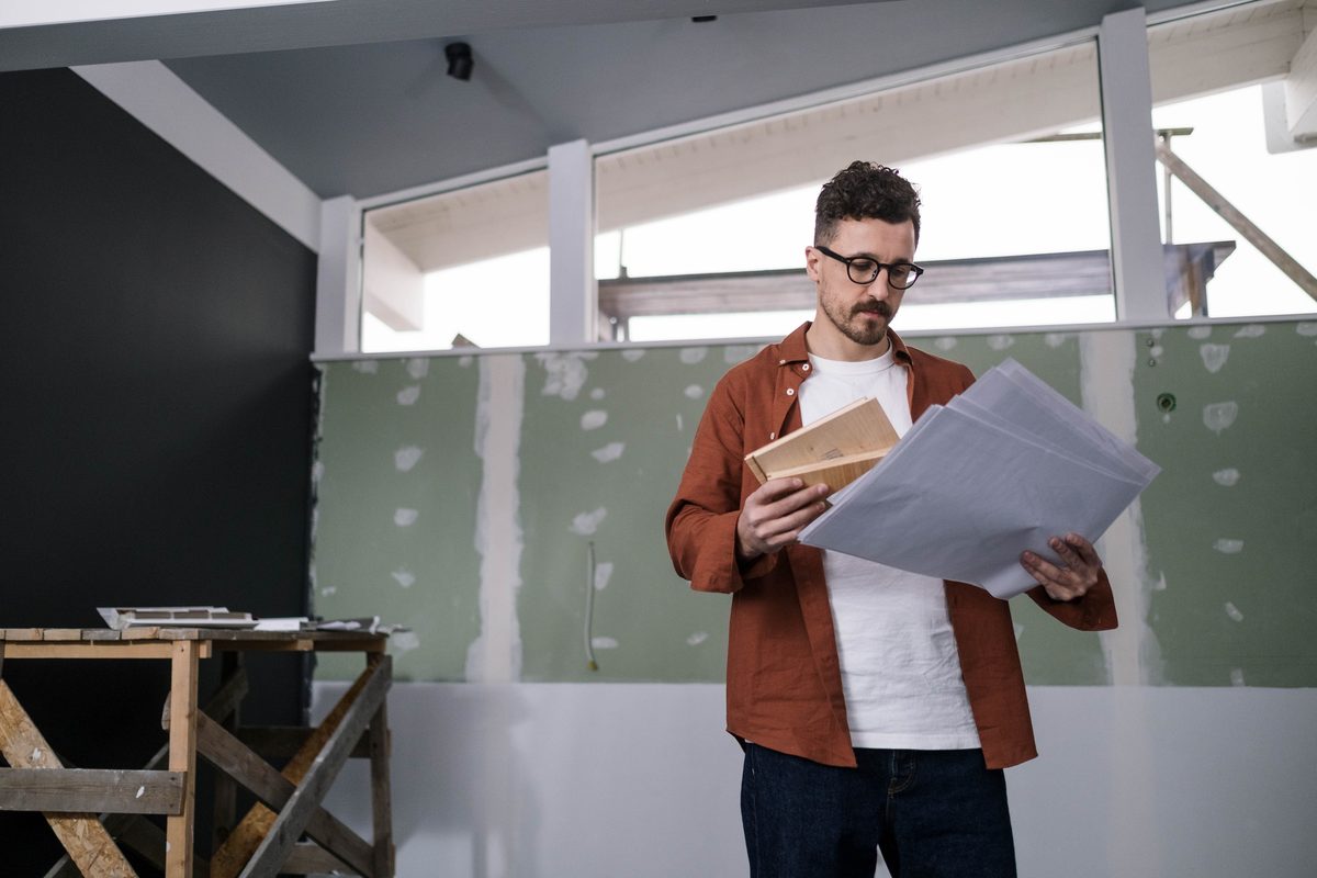 Construction site supervisor reviewing plans