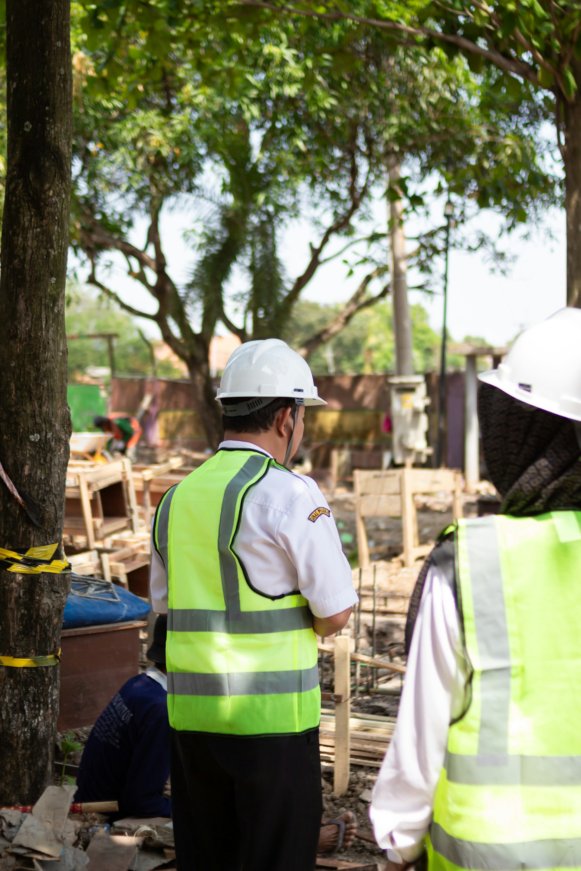 Construction workers in hard hats at site